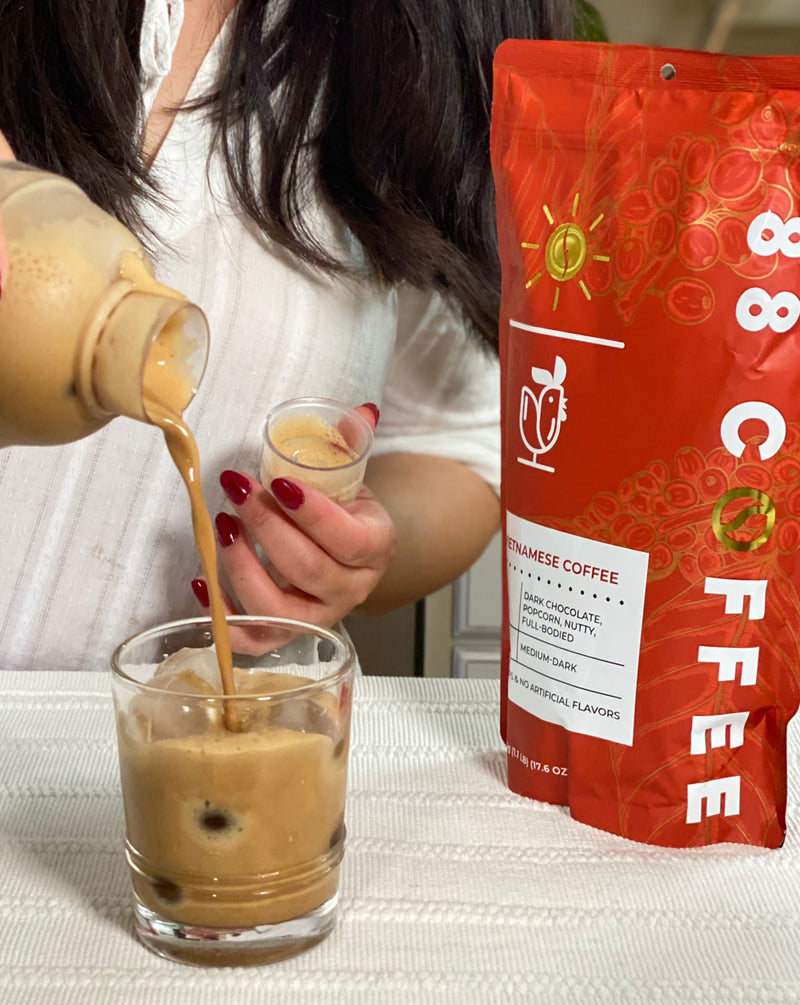 pouring shaken vietnamese coffee into cup 